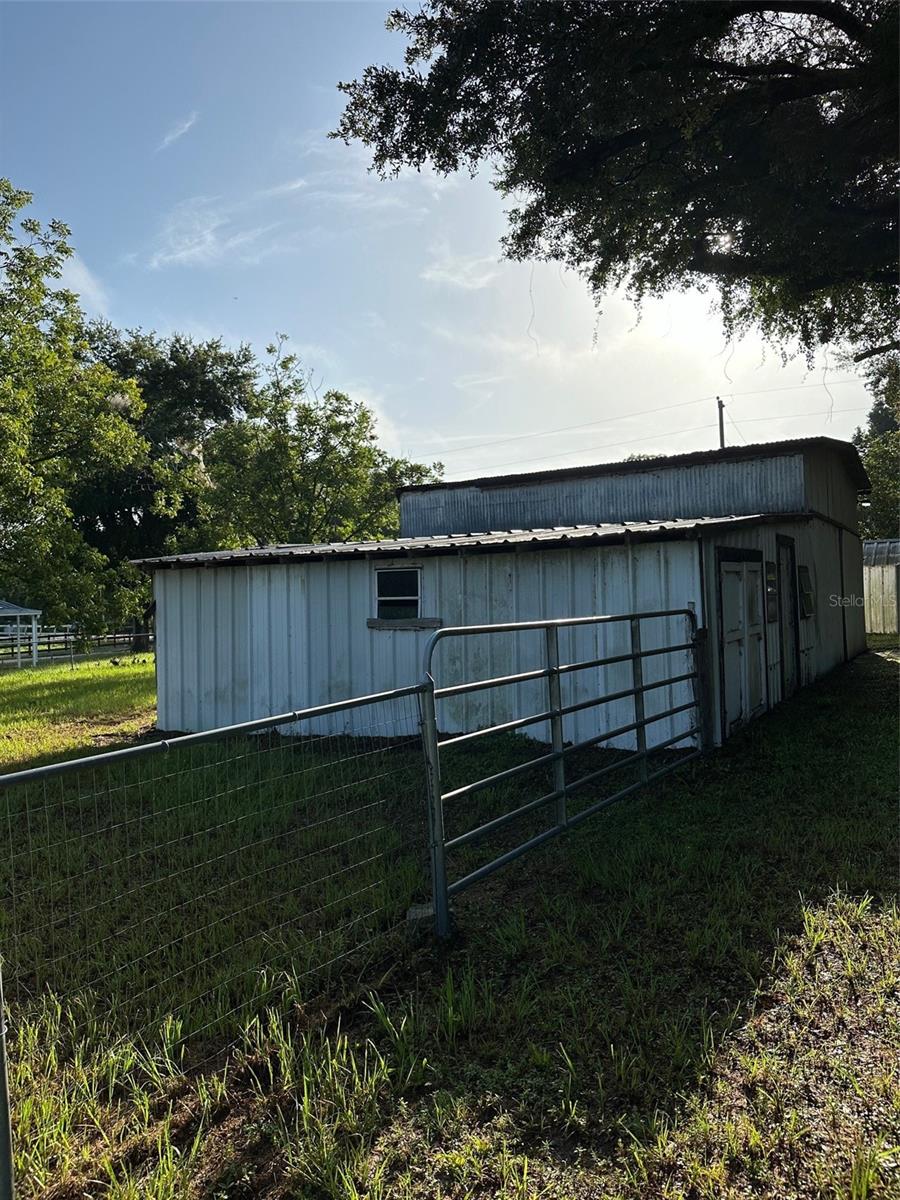 Side of barn land extends to the second fence