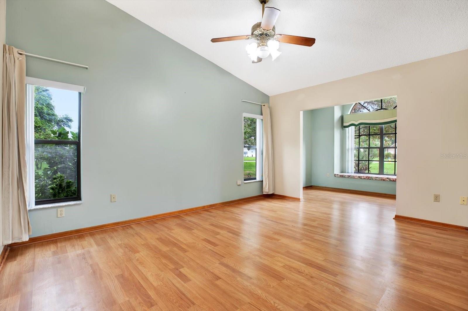 The Master Suite with Vaulted Ceiling & Sitting area.