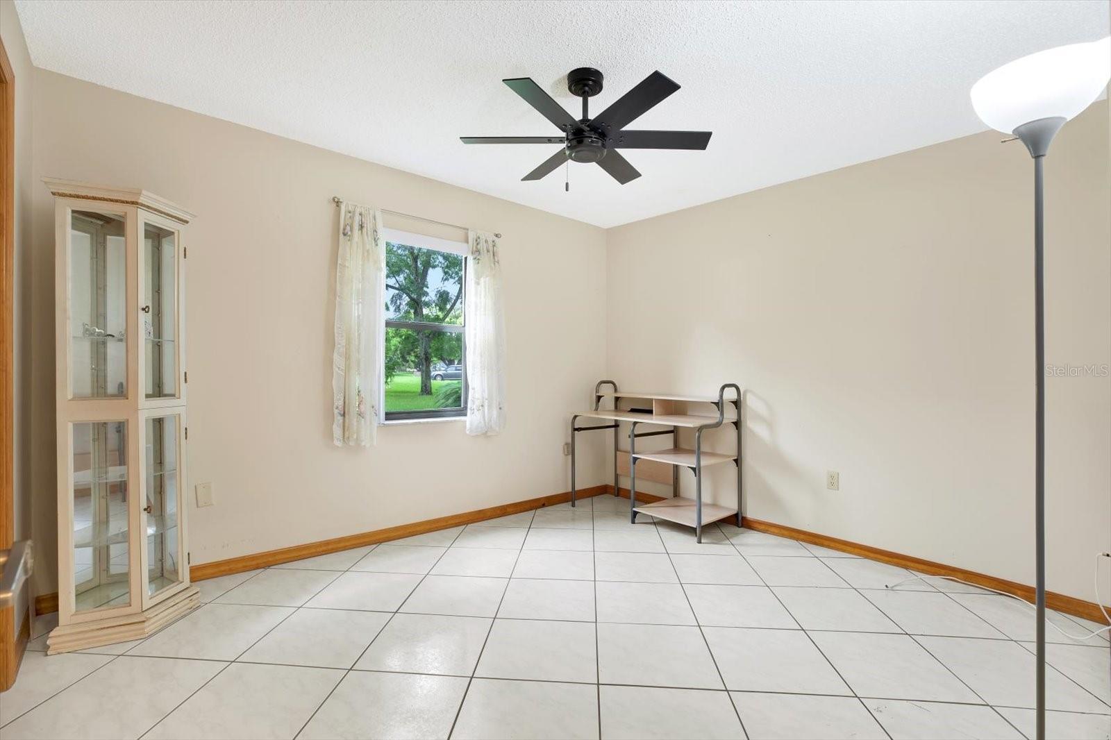 3rd Bedroom with a double closet & ceiling fan.