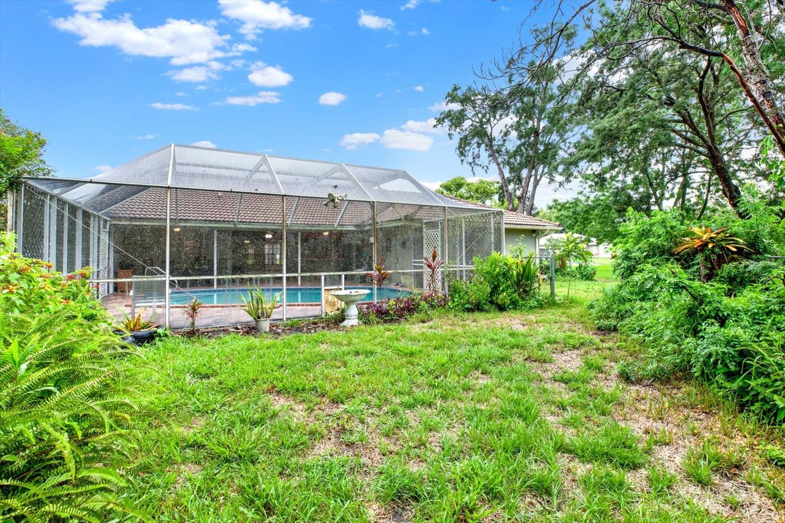 Lush mature landscaping adds privacy.