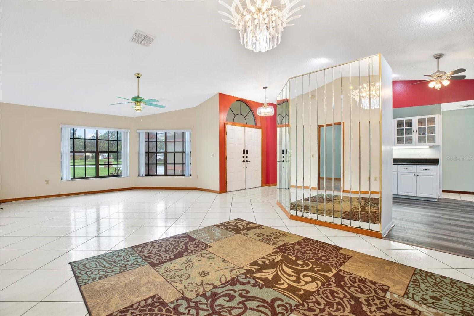 Another view showing the entry and a peek into the Kitchen.