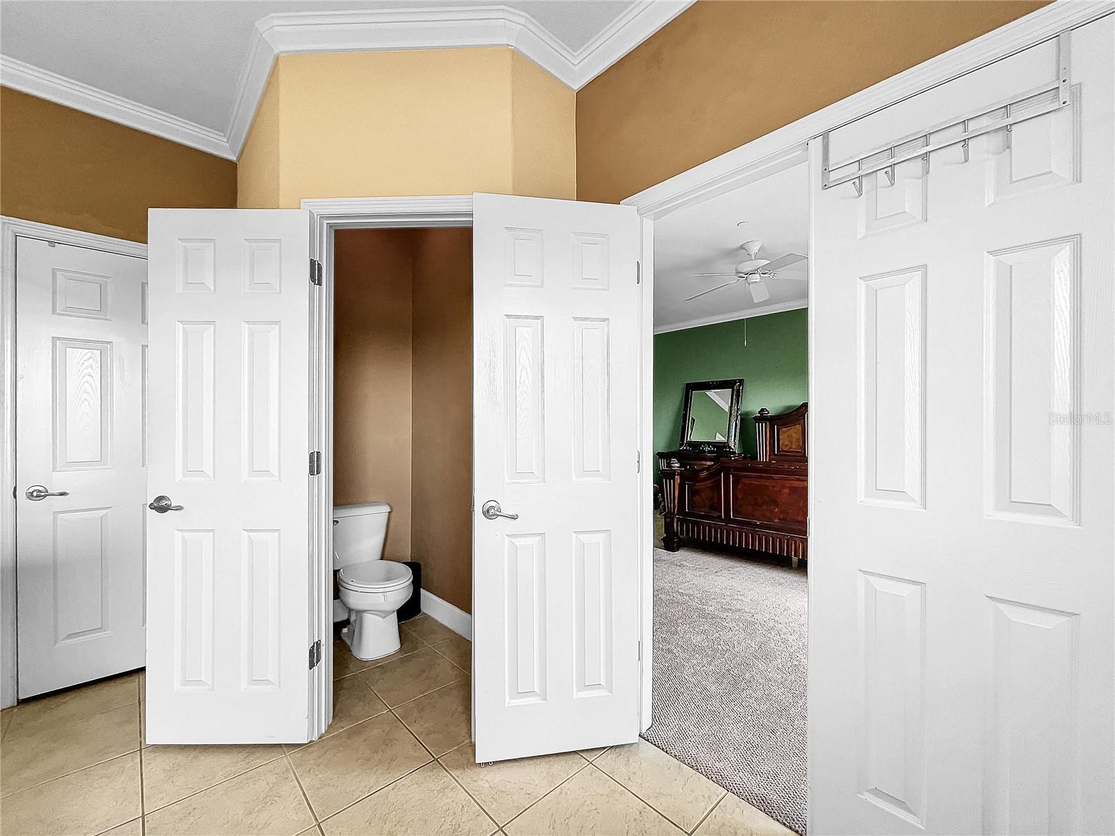 Water closet in master bathroom.