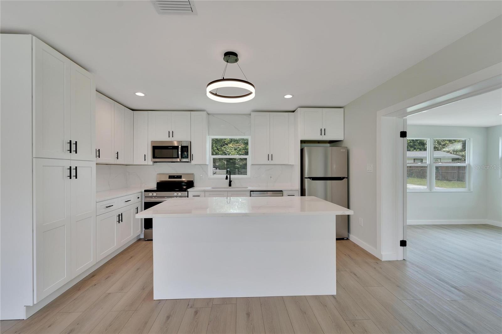 Kitchen-(Quartz Countertops, Dual Sinks and Brand New Stainless Steel Appliances)