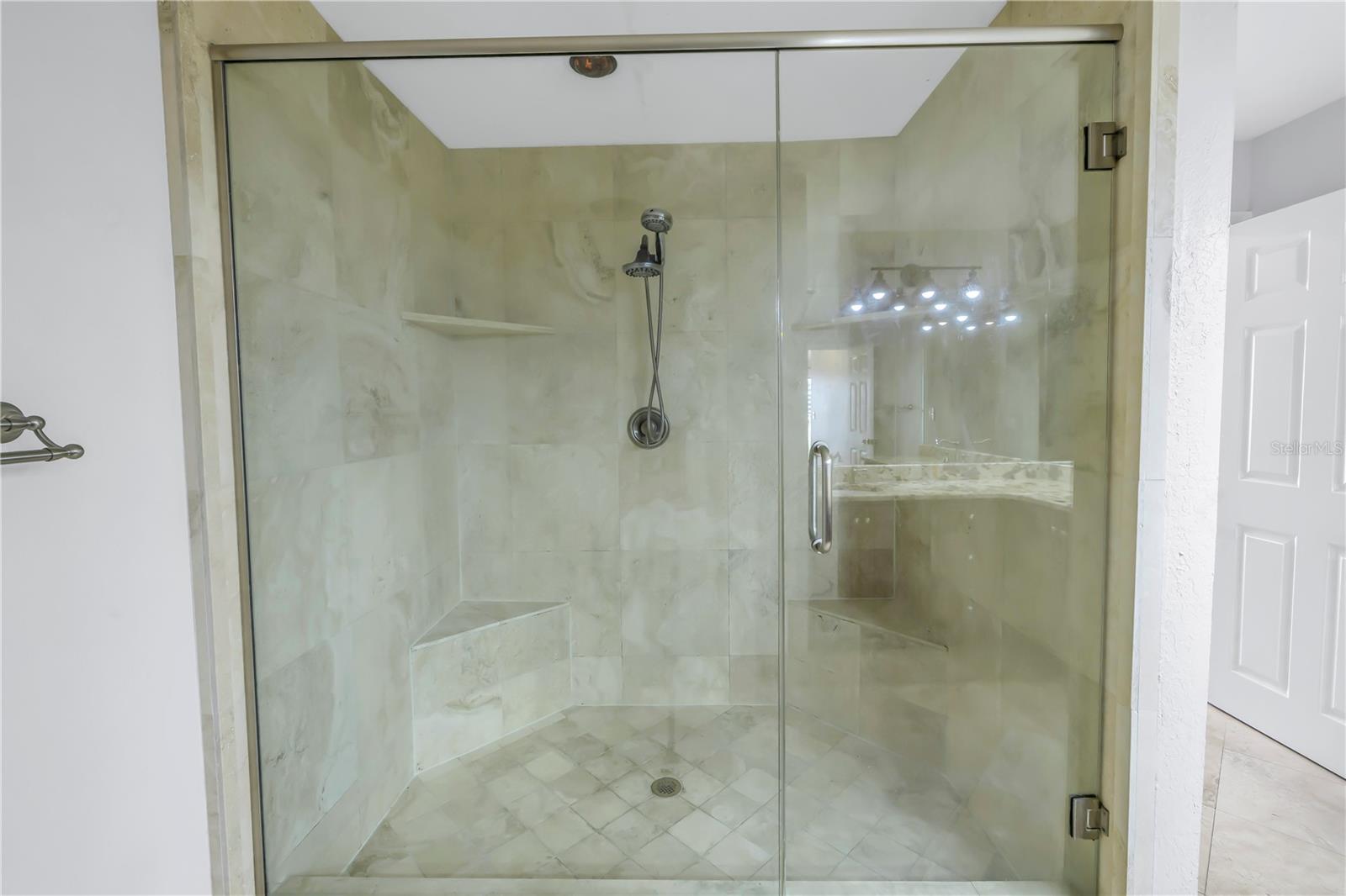 Tile walk-in shower.