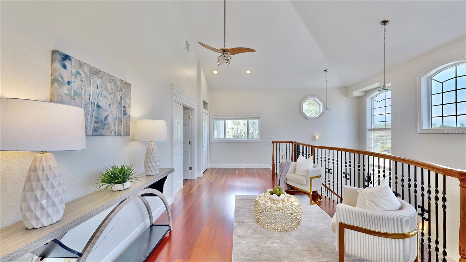 Charming loft space, perfectly designed to lead you into the inviting primary suite. This light and airy loft offers a comfortable and open atmosphere, ideal for relaxation or creative pursuits. Whether you're looking for a cozy reading nook, a home office, or a tranquil retreat, this versatile space has it all.