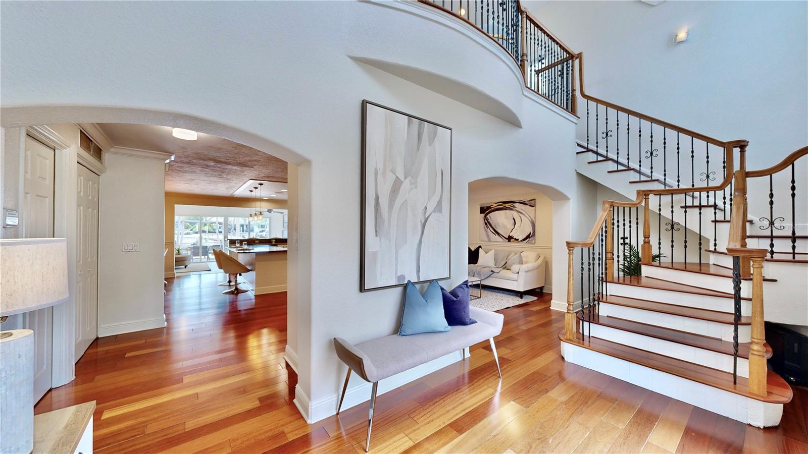 Classy entryway with stairs leading to loft area and owners retreat.