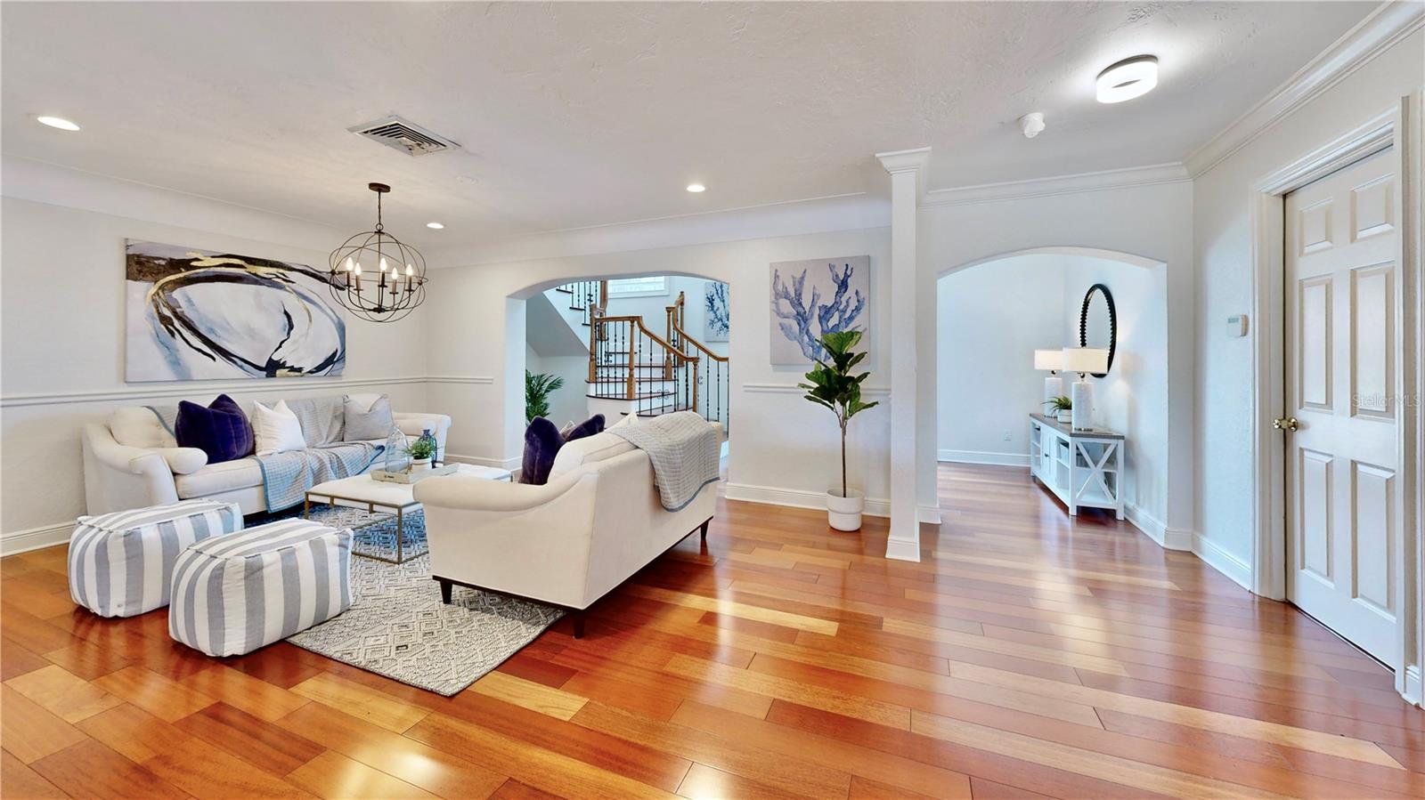 Open formal living room between entry way and kitchen. Also, door leading to garage.