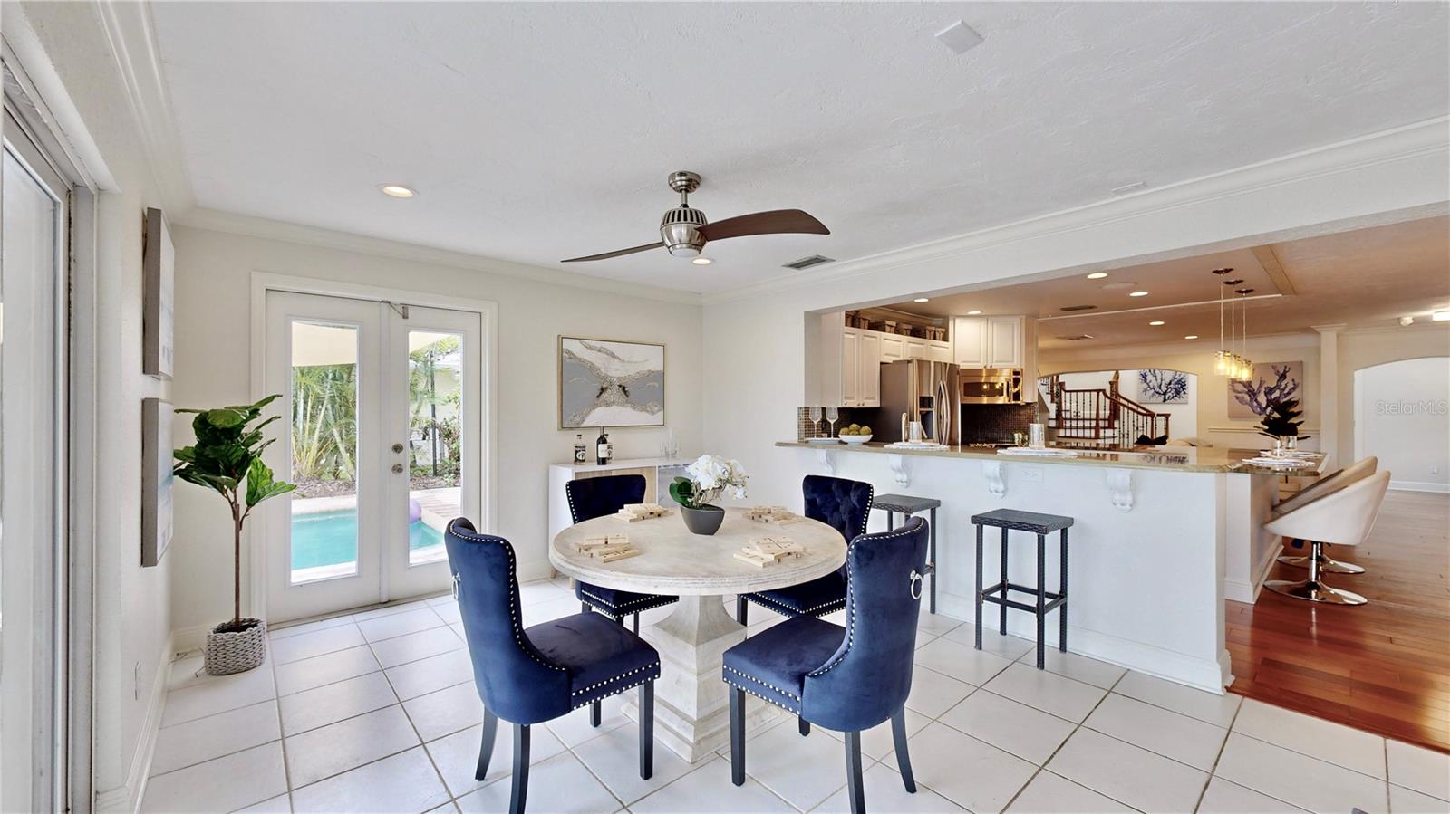 Breakfast nook overlooking pool and waterfront.