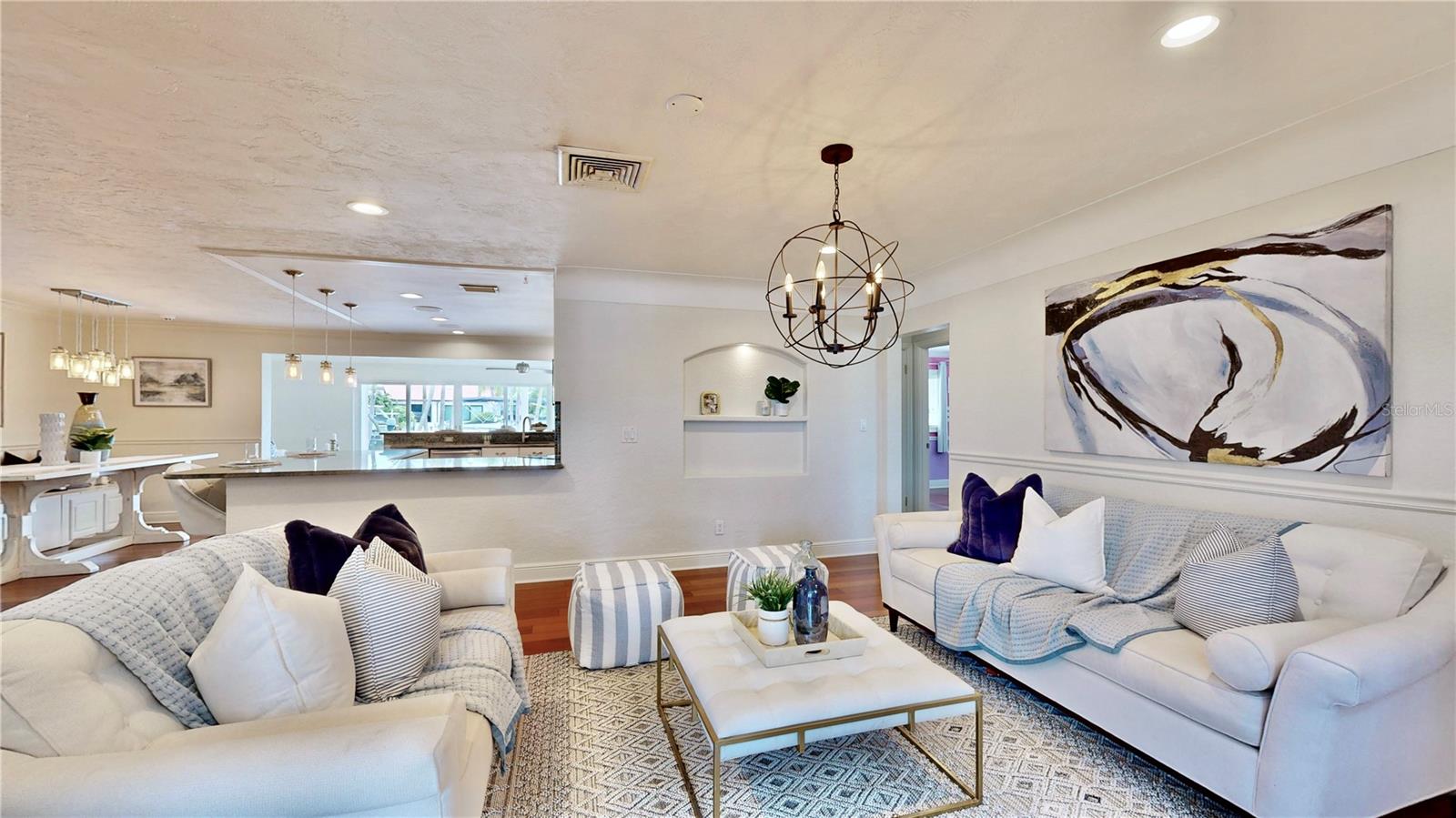 Open formal living room between entry way and kitchen.