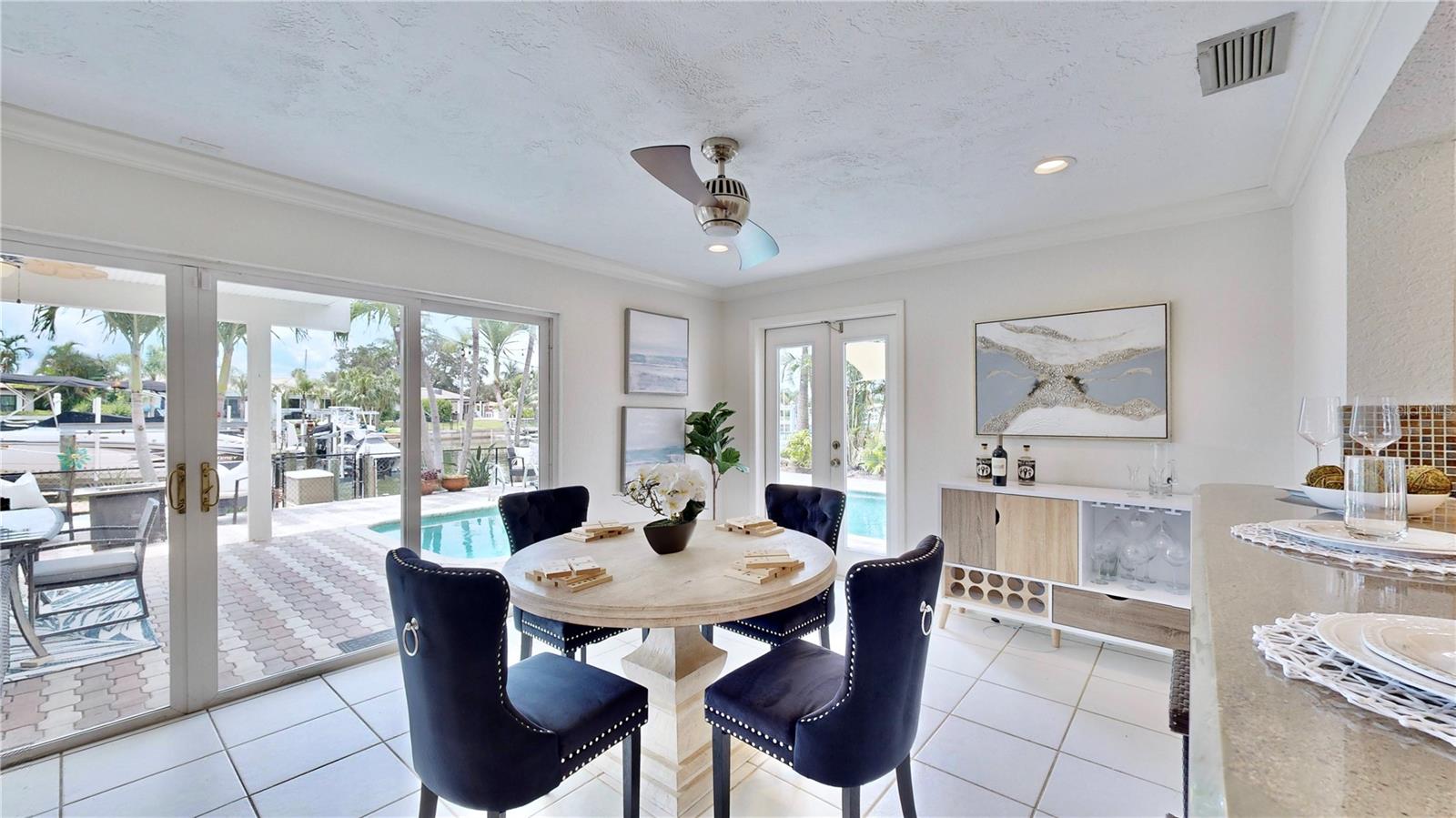 Breakfast nook overlooking pool and waterfront.