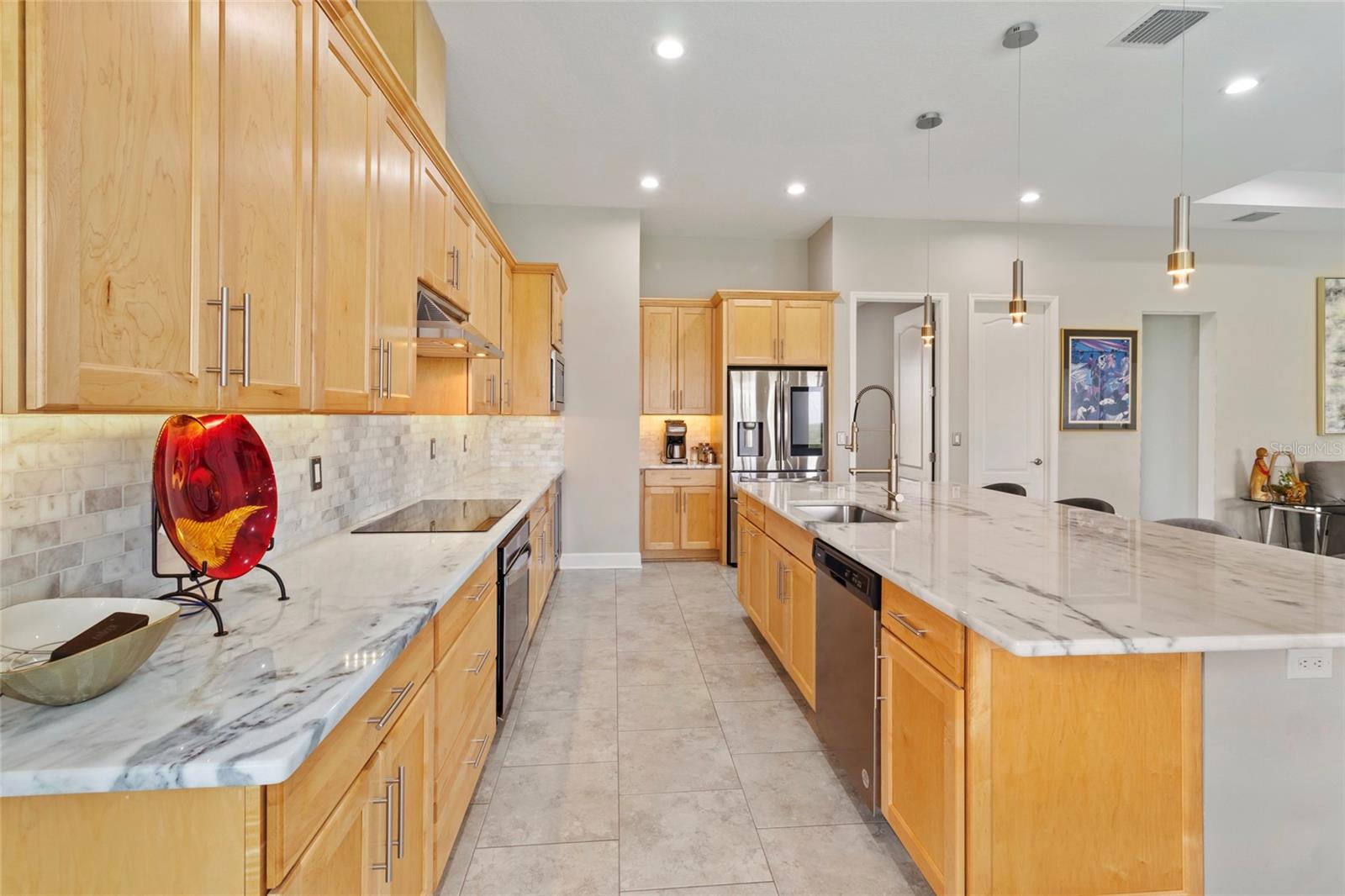 5'x10' Island with Athena white Dolomite (Marble) countertops throughout kitchen and Primary bath