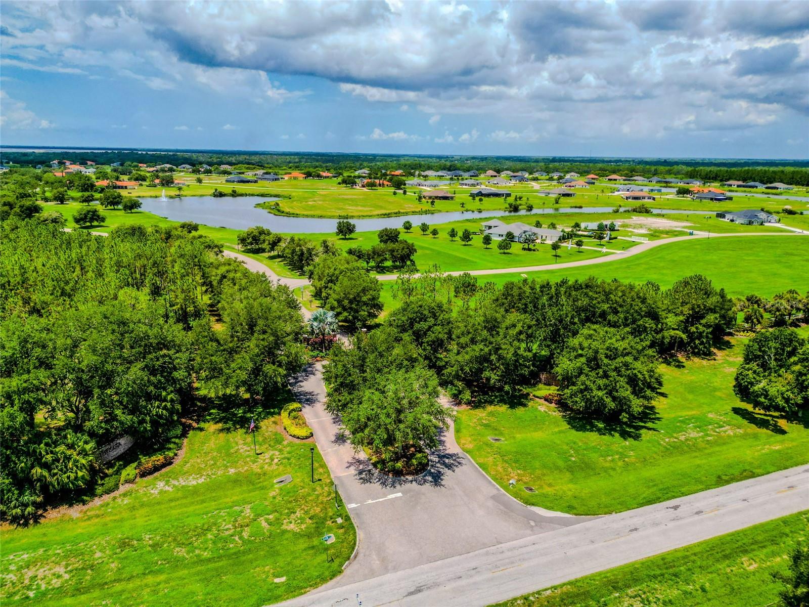 Below the tree line is a gated entry to paradise known as Lake Toscana.