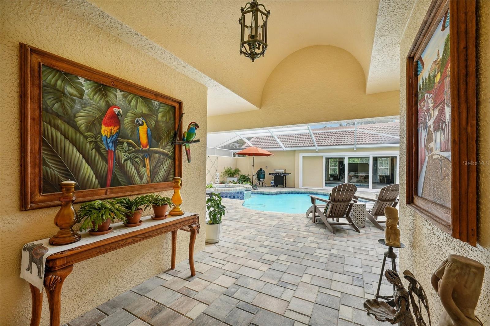 Front entrance into home and pool/lanai area view