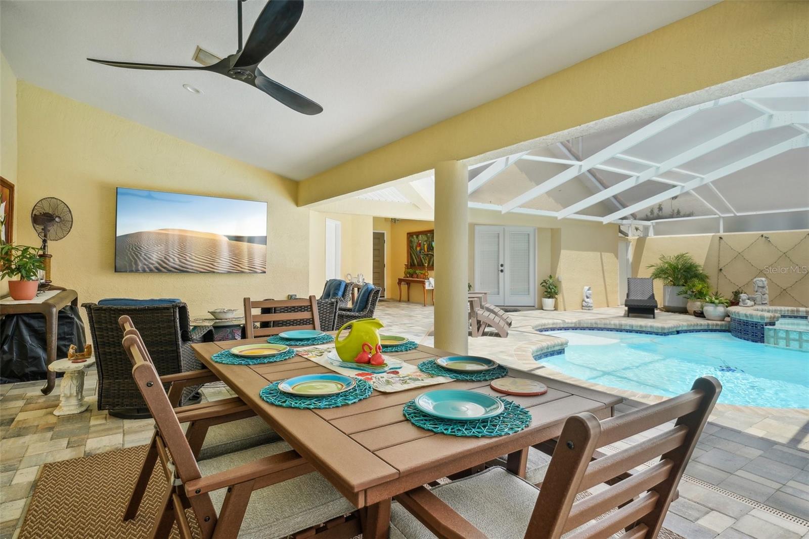 View of the 85" TV and pool from the lanai