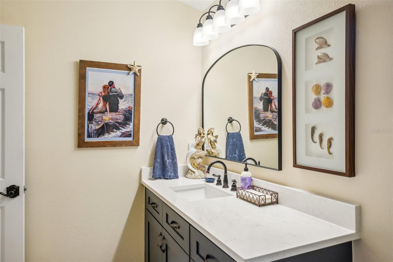 Guest bathroom, single vanity area with quartz countertop