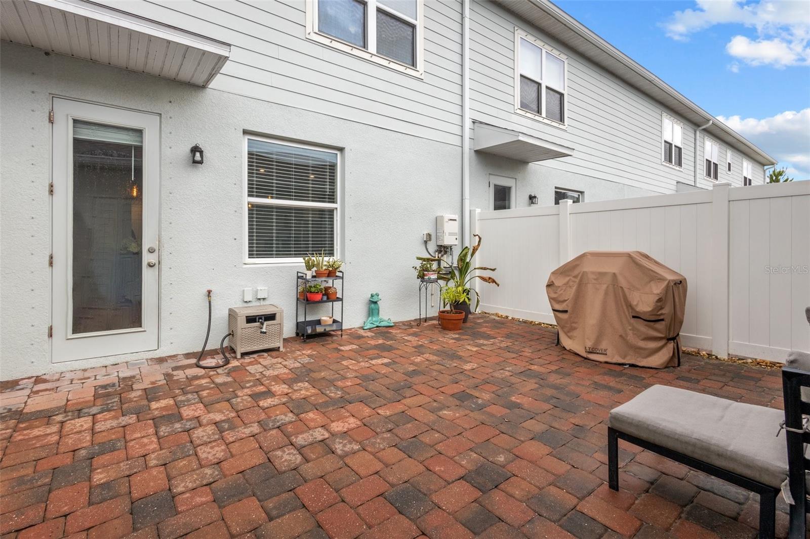 Courtyard between home and 2 car garage