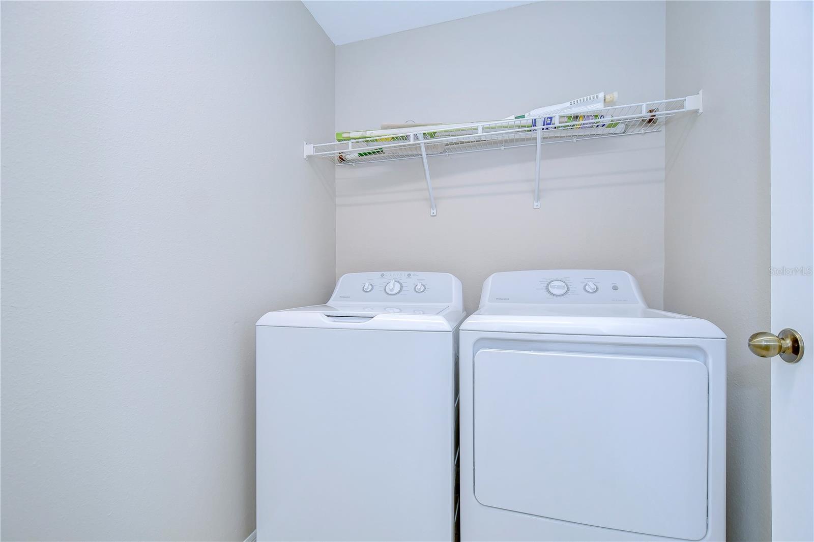 Laundry room offers extra space for storage!