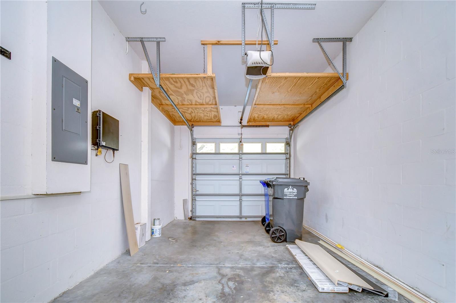 Garage features overhead storage racks!