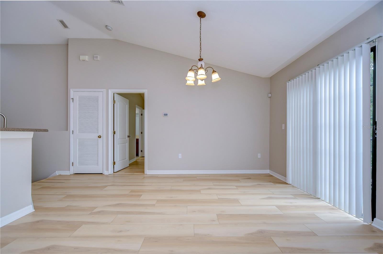 Dining room features sliders to balcony!