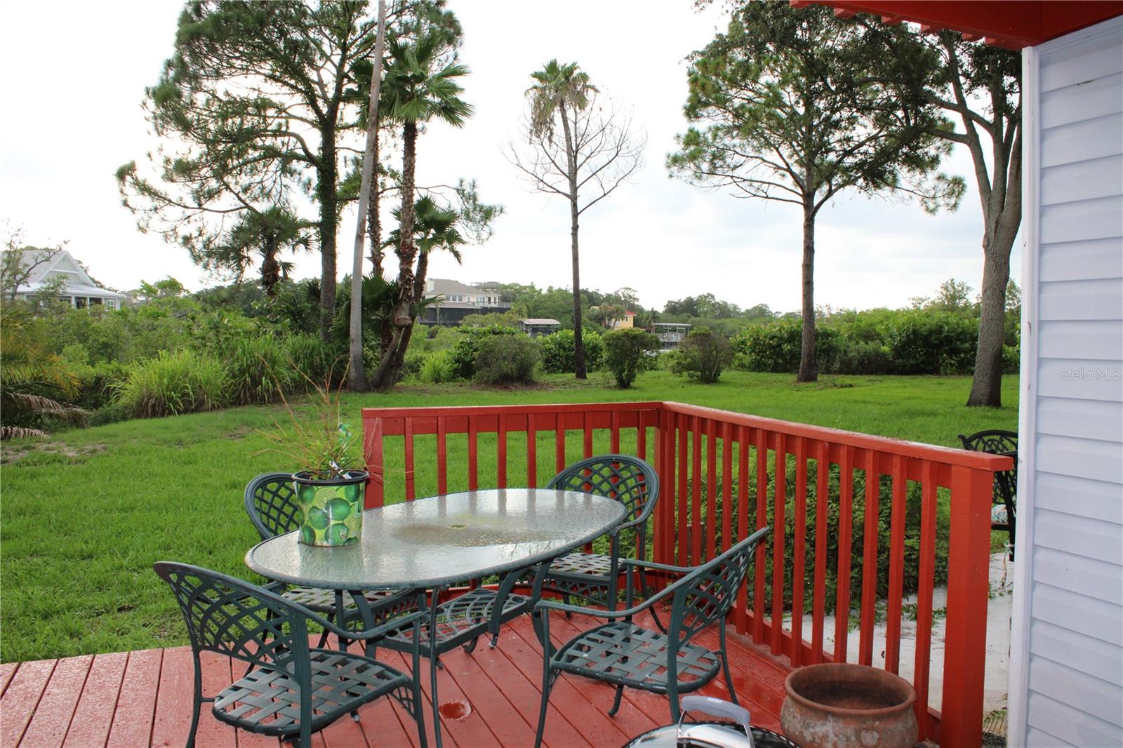 Second-floor deck with stair access.