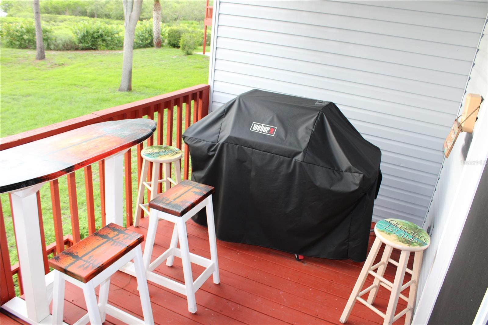 Second-floor deck with stair access.