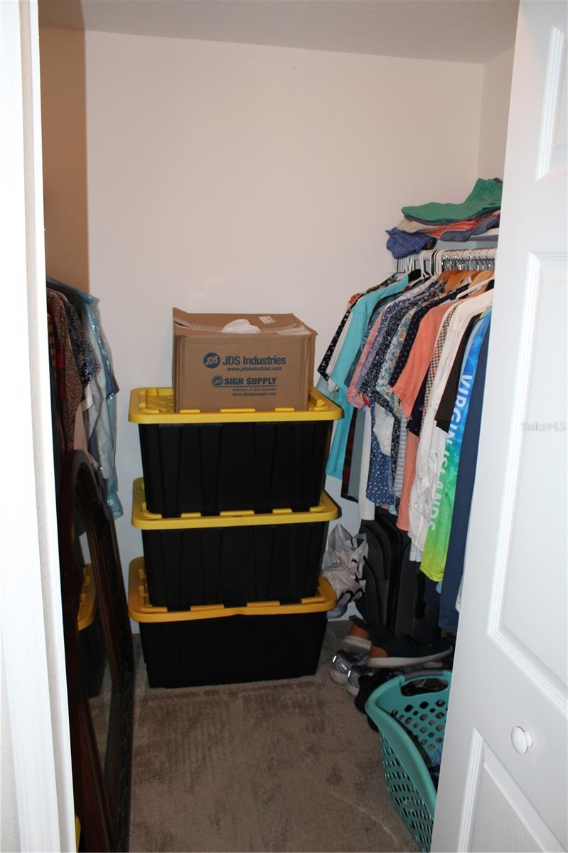 one of two closets in master bedroom