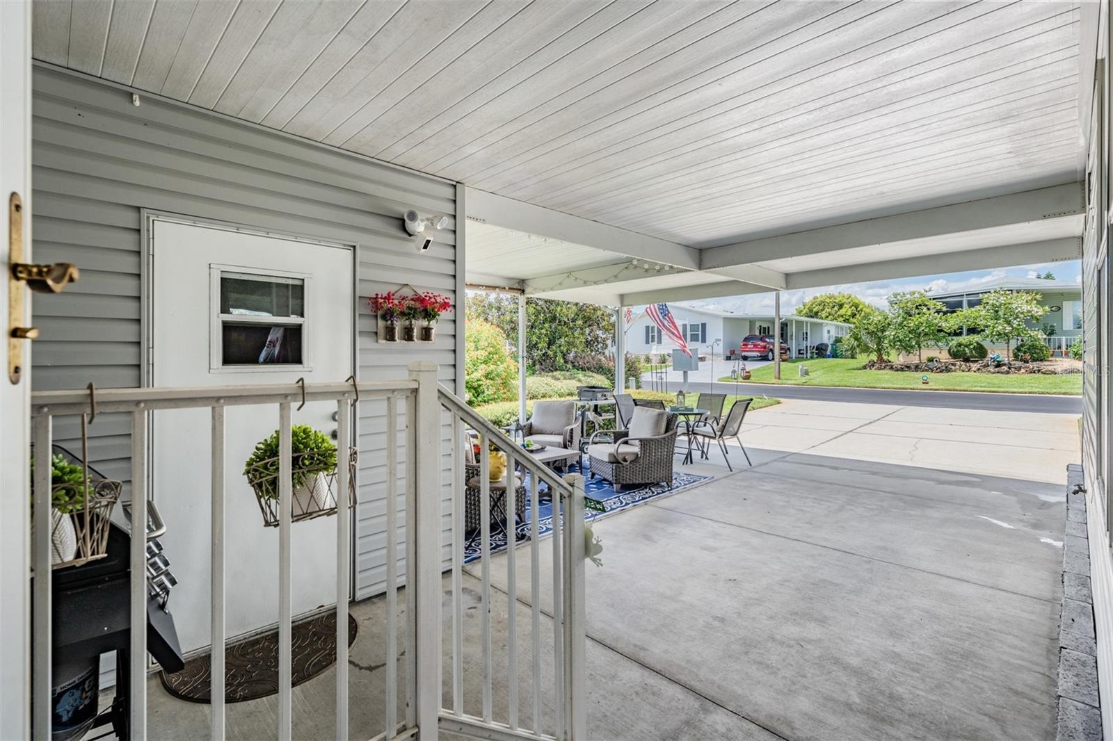 Covered carport holds 4 cars!