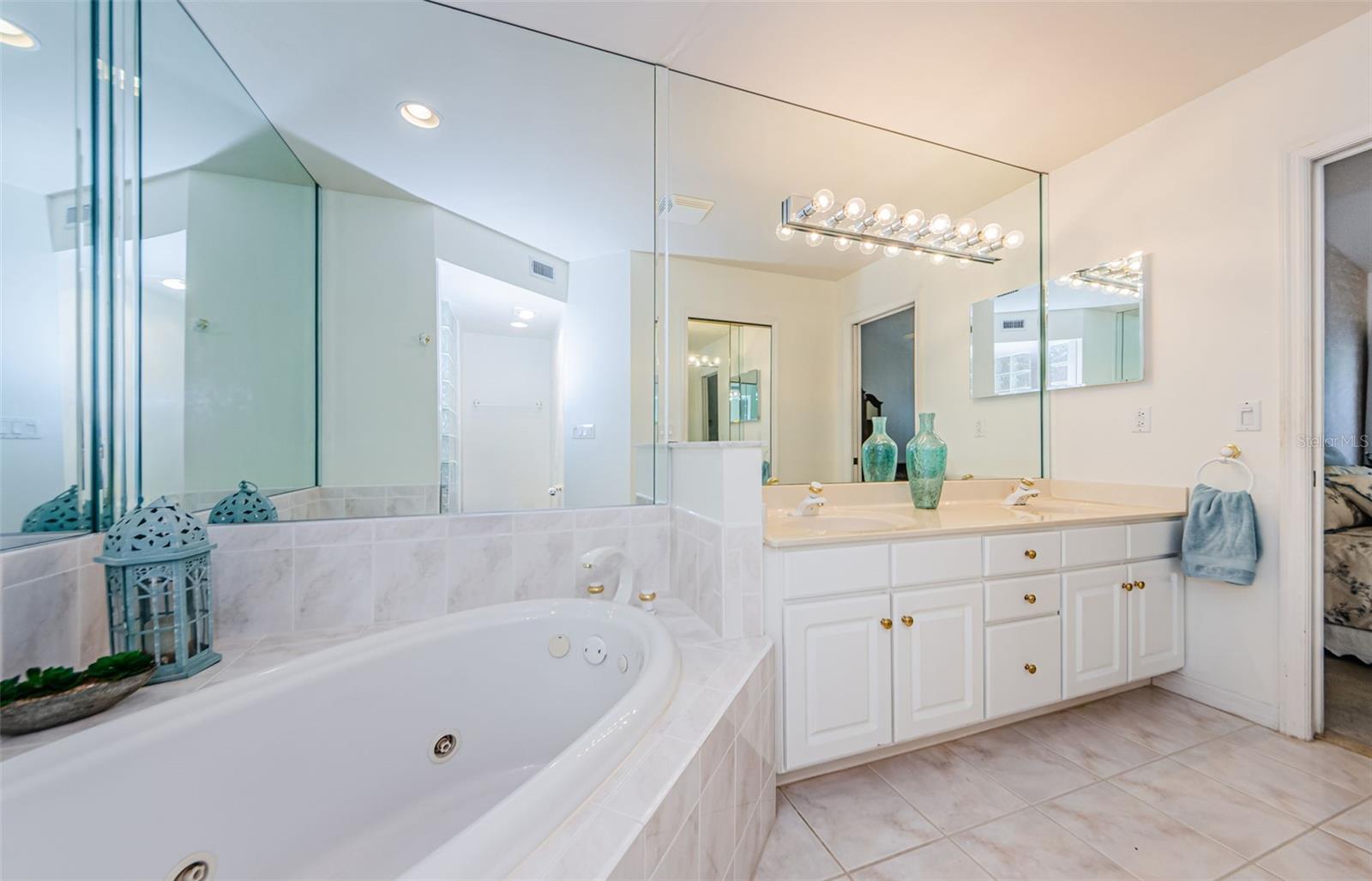 Master bath with double vanities, soaking tub and walk in shower. There is a huge walk in closet as well!