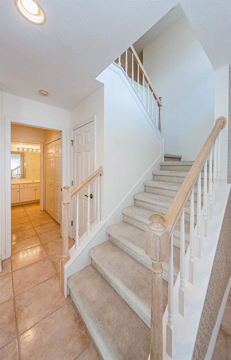 Traditional staircase leads to 3rd bedroom and full bath and office area and huge walk in closet. Perfect for guests or the older child!