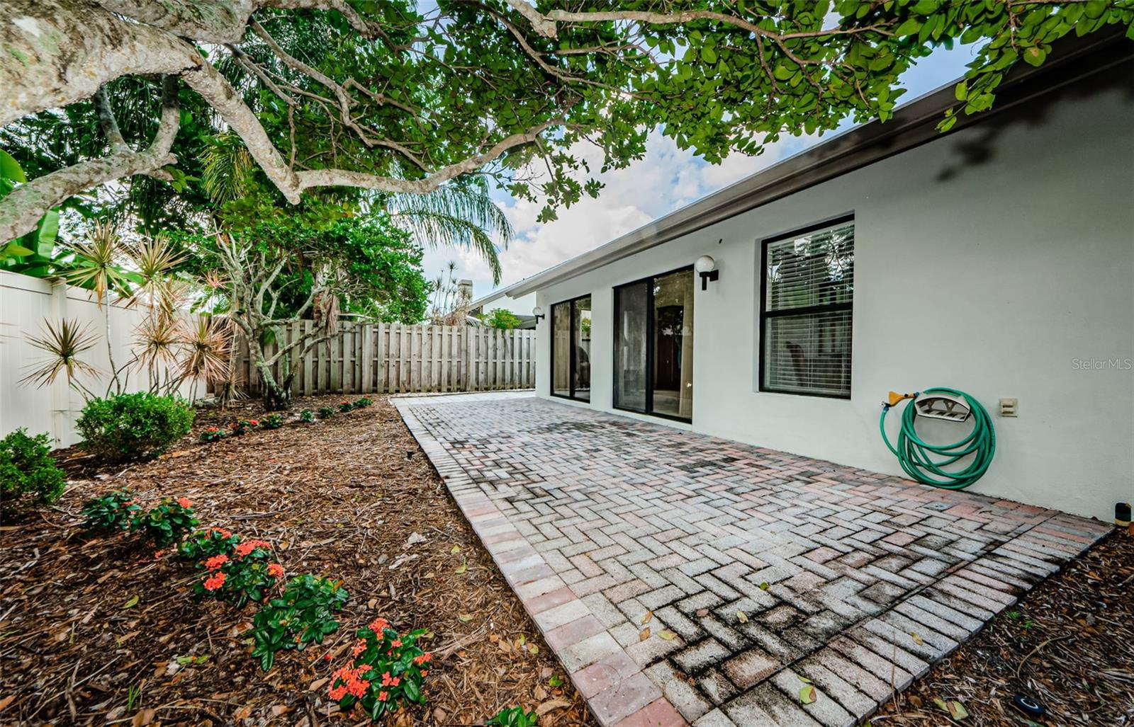 Back courtyard, two sliders belong to the living room and window is the master bedroom. So much natural light and privacy!