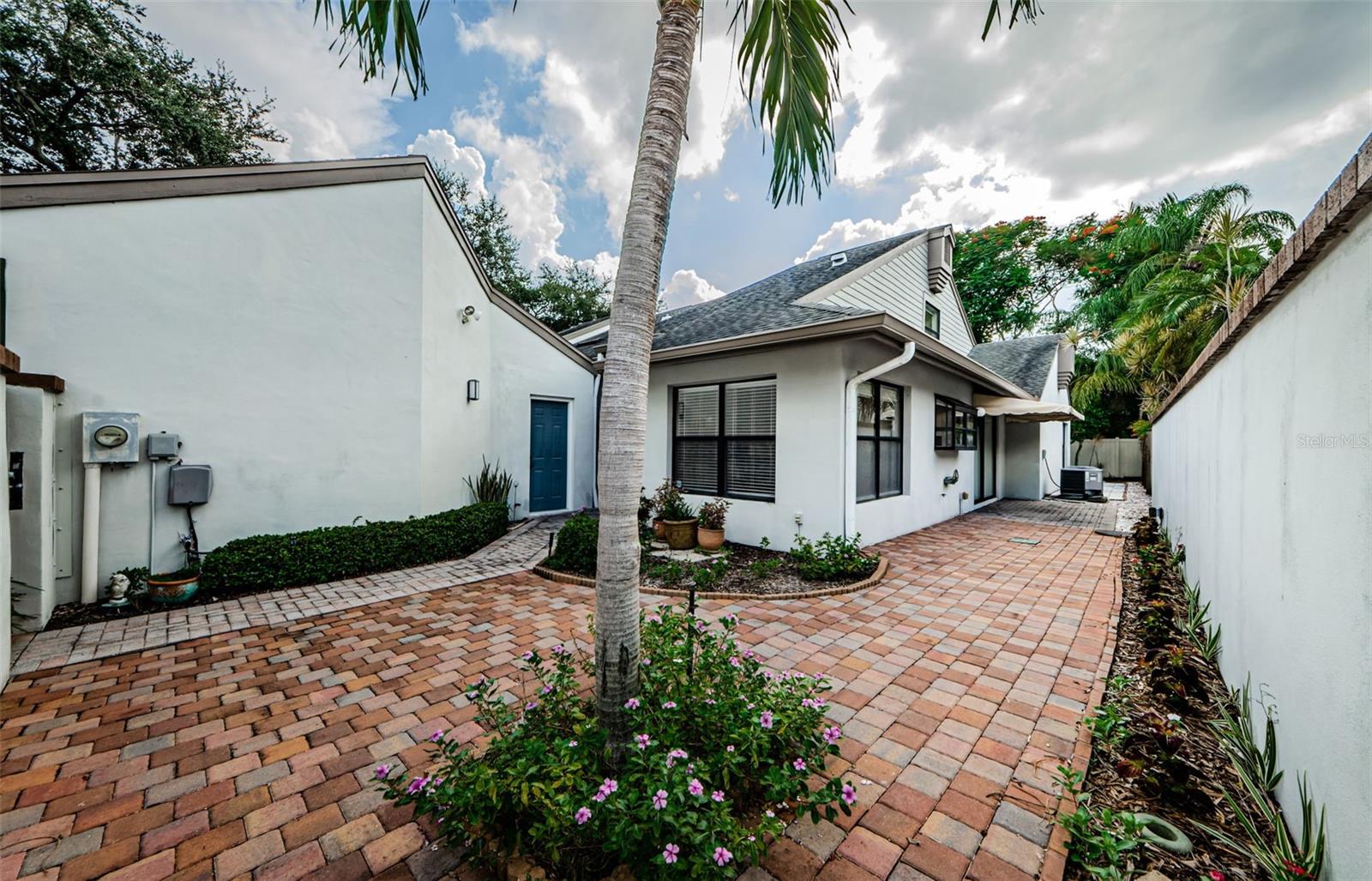 Your Private front courtyard, front and side... the blue door goes into the spacious one car+ garage!