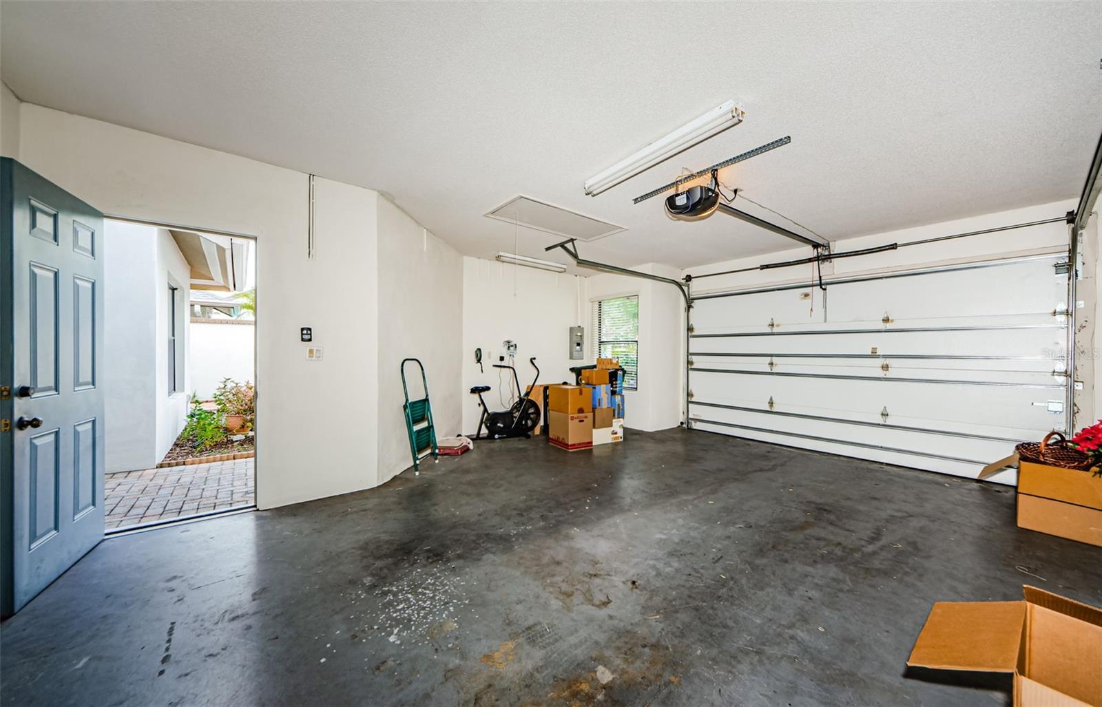 Wonderful one car plus garage with storage and attic space. Room for a workbench too!