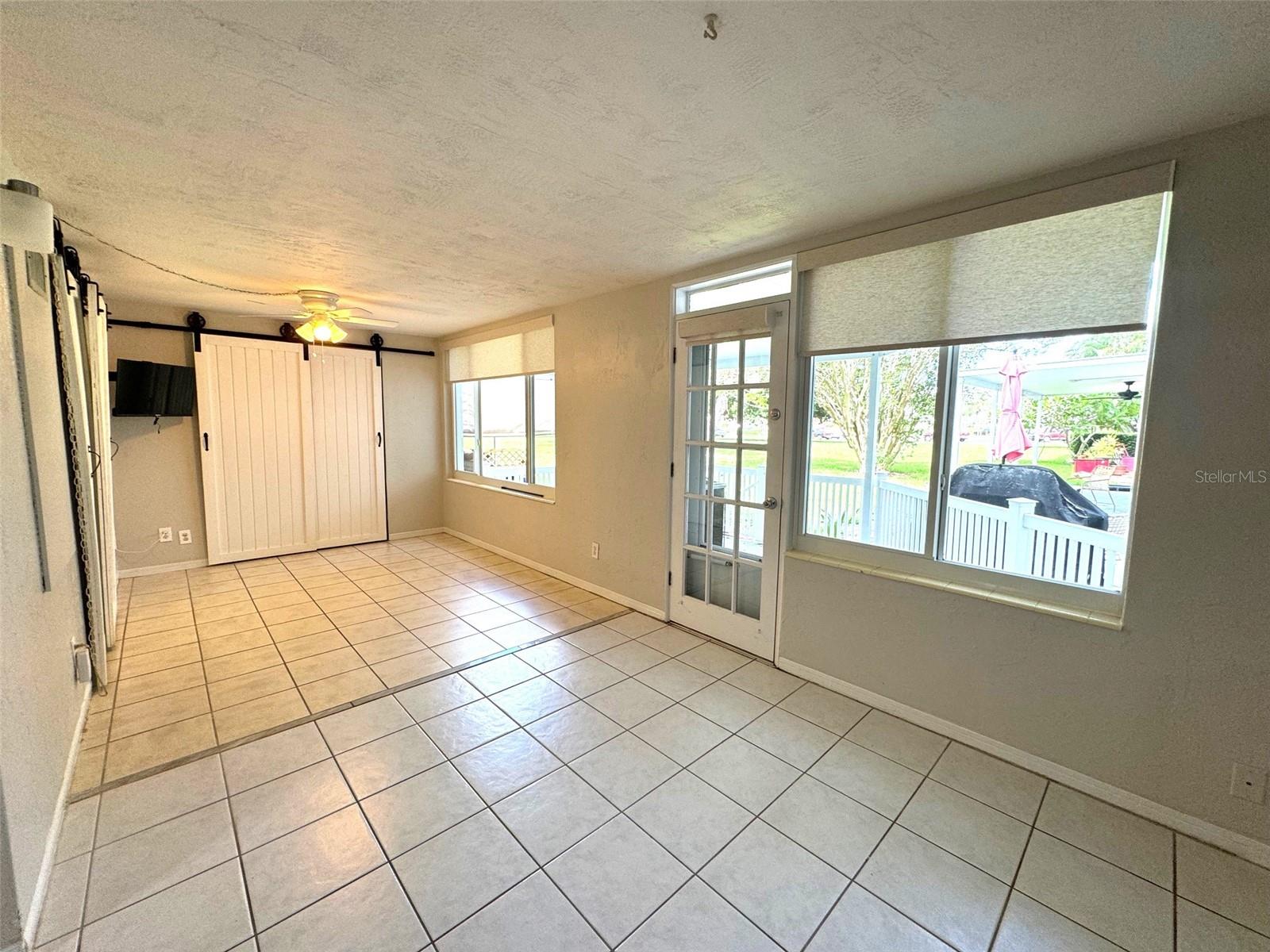 Tiled Florida Room w/easy access to back porch