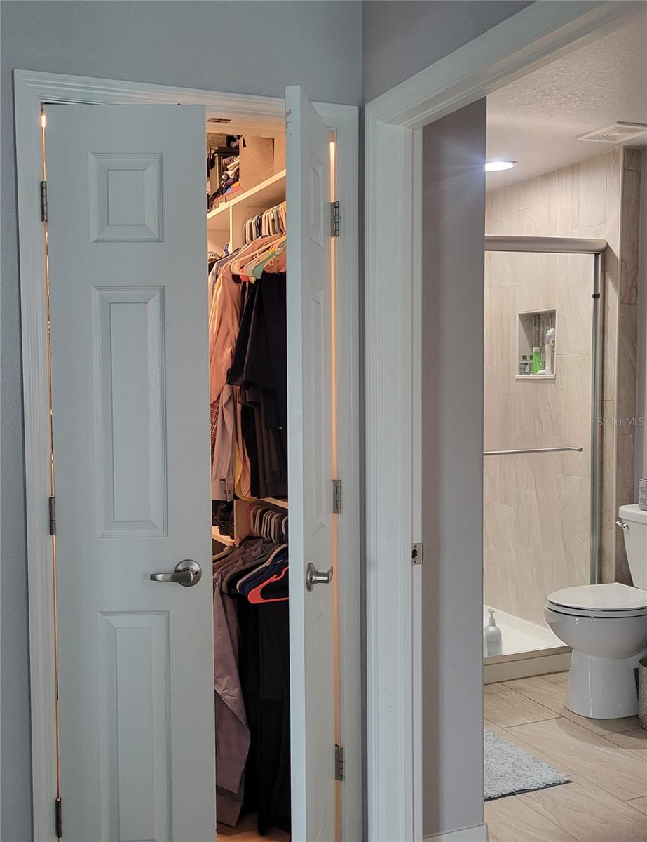 CUSTOM CLOSET WITH SPIT DOOR ENTRY