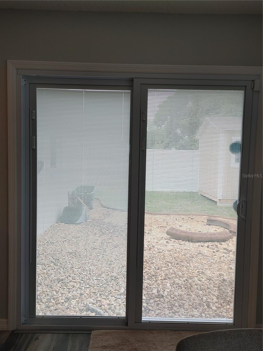 Custom installed sliding glass doors for easy access to the back yard.