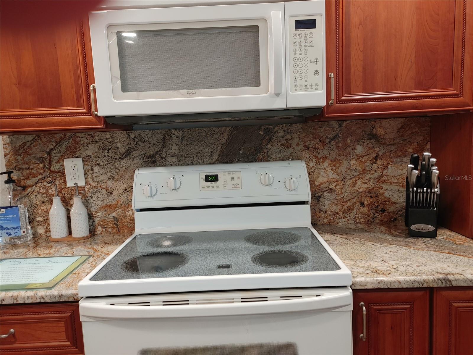 Backsplash covers the entire wall behind the over/stovetop