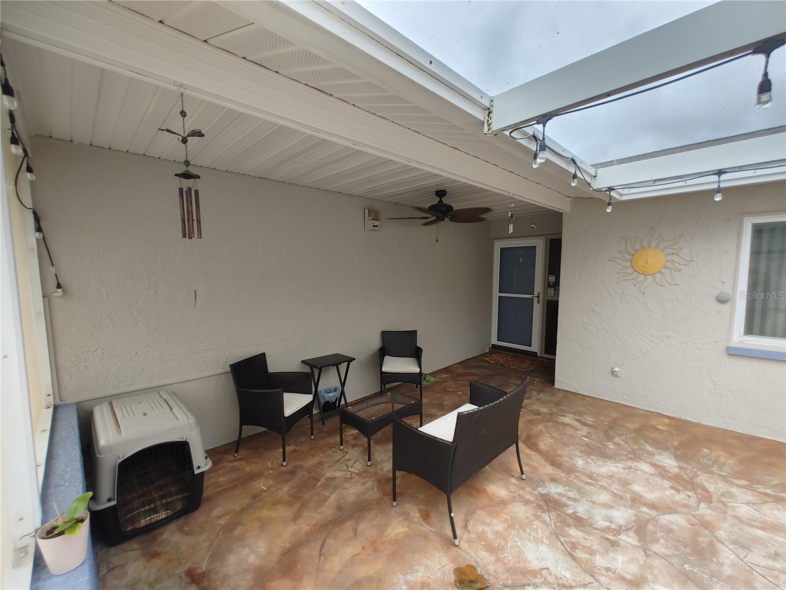 Partially covered and screened in front porch allows for a dry shaded area to keep dry and cool down.