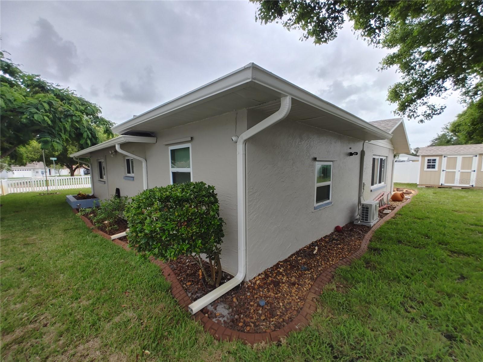 Gutters and large drain pipes all around the house with leaf guards, no more messy clean up.