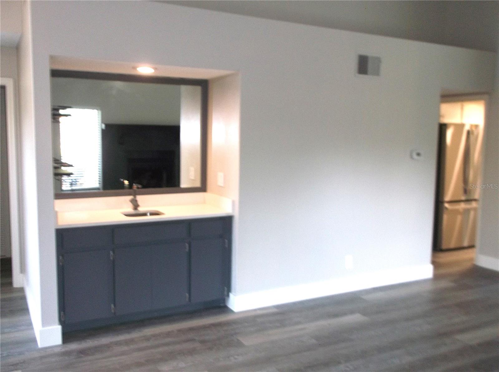 Another view Hallway to left leads to Guest Bedroom and Bathroom hallway to right enters Kitchen and Master Bedroom