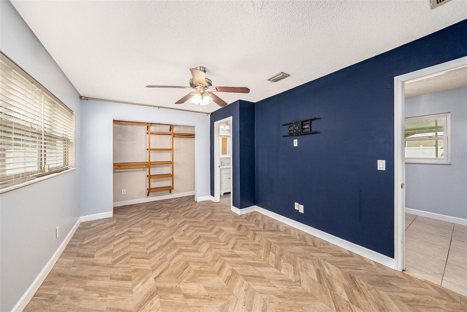 Cute kitchen with real wood cabinetry, tiled backsplash and counters, and breakfast bar.