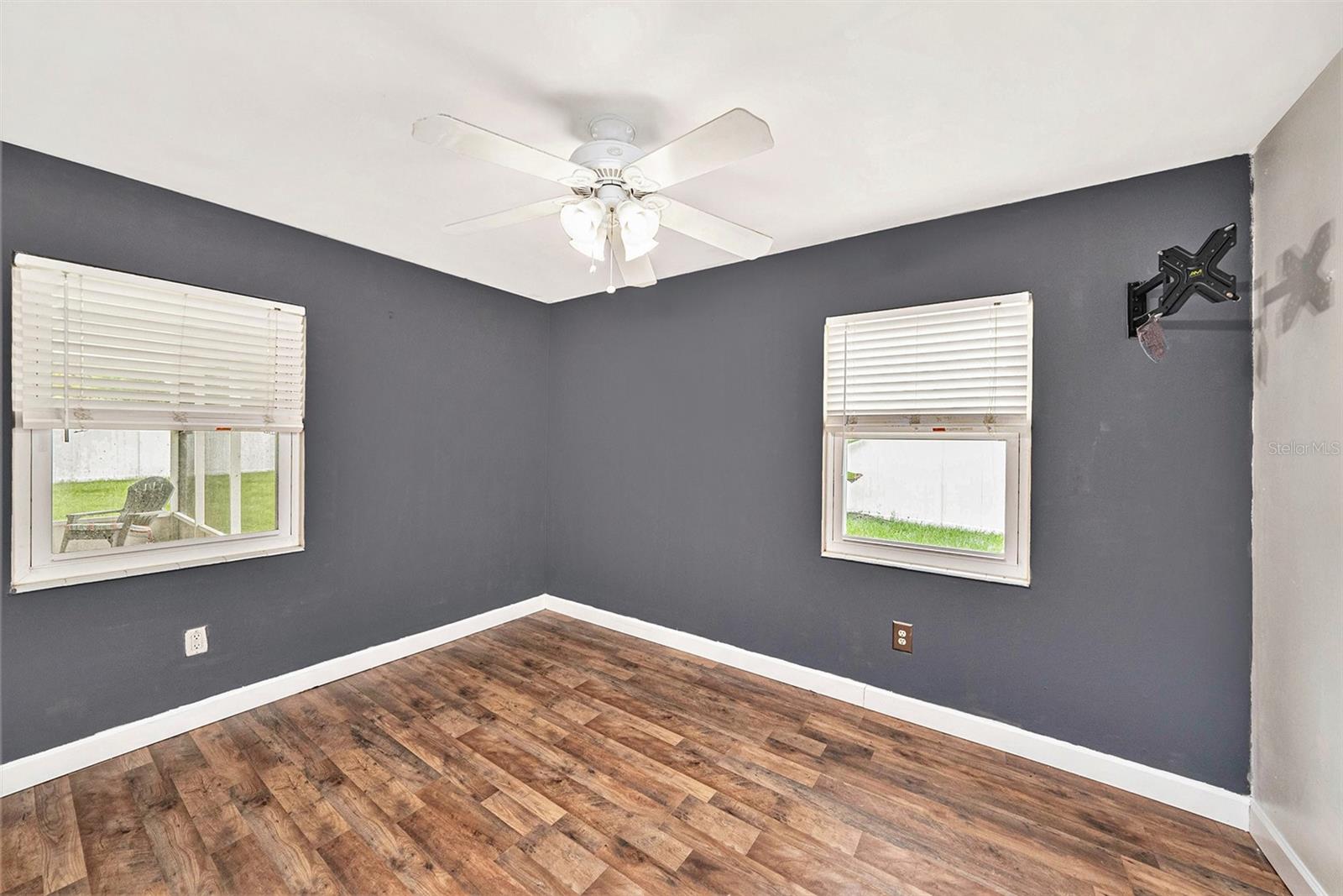 Just off the kitchen is the dining room with access to the screened lanai and massive backyard.