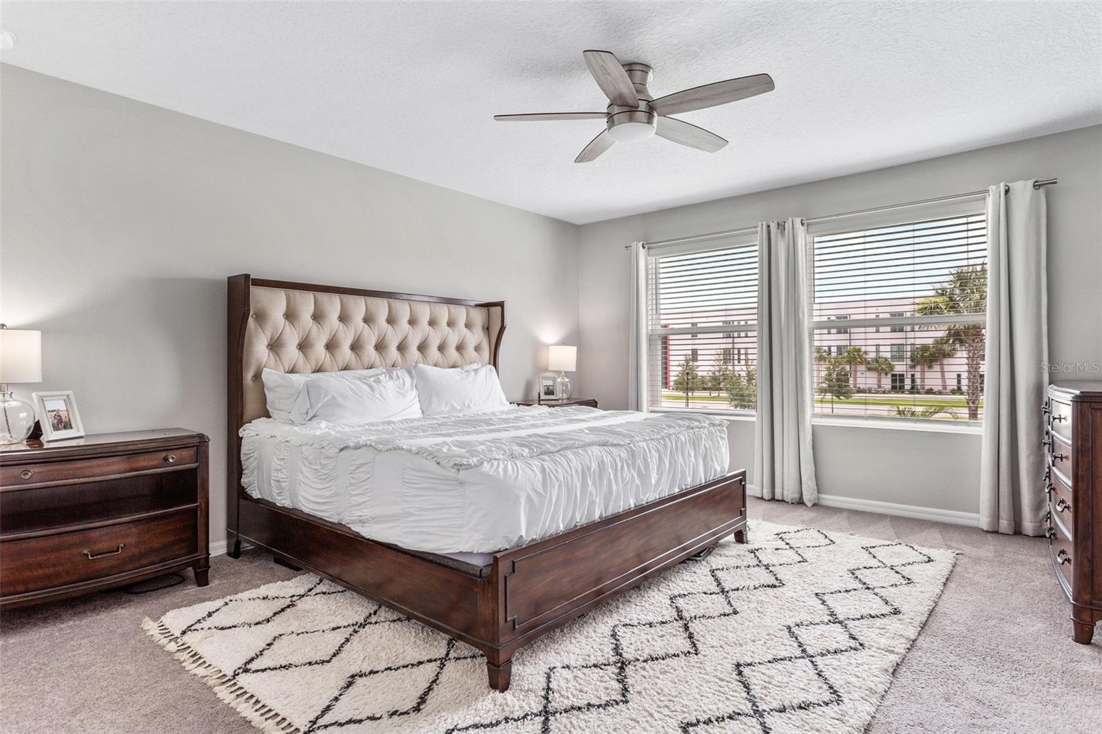 Primary bedroom with ceiling fan