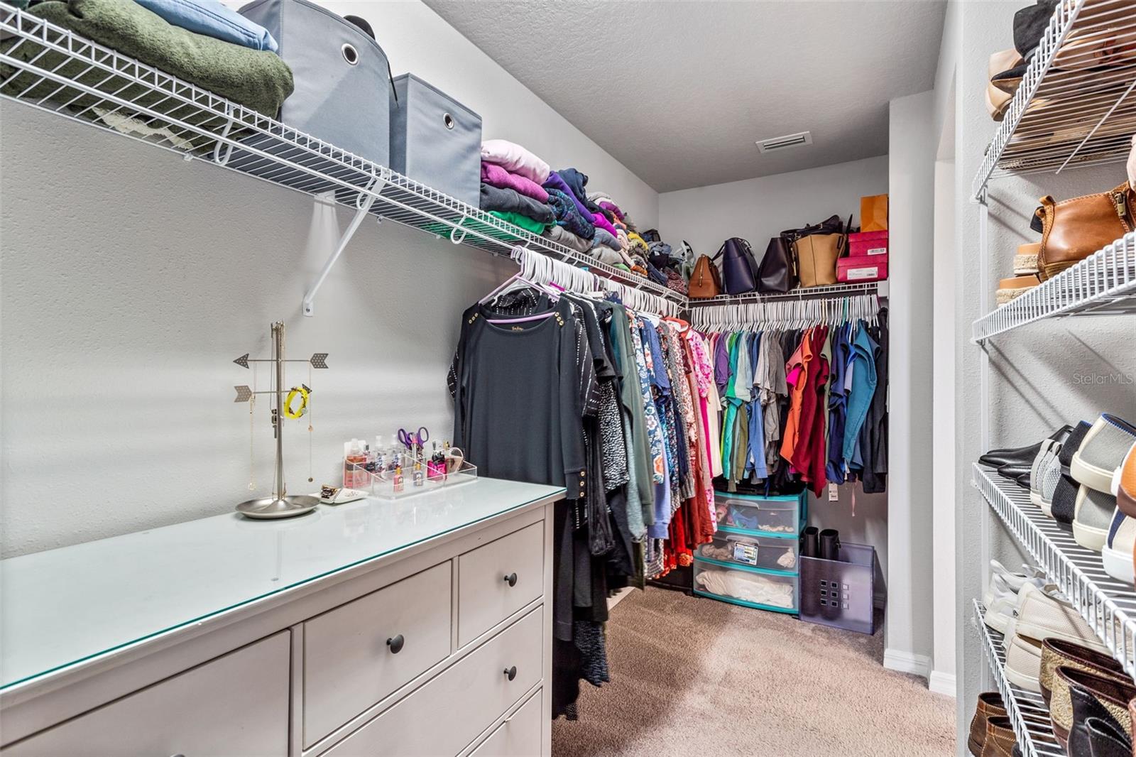 Large walk in closet off of primary bathroom