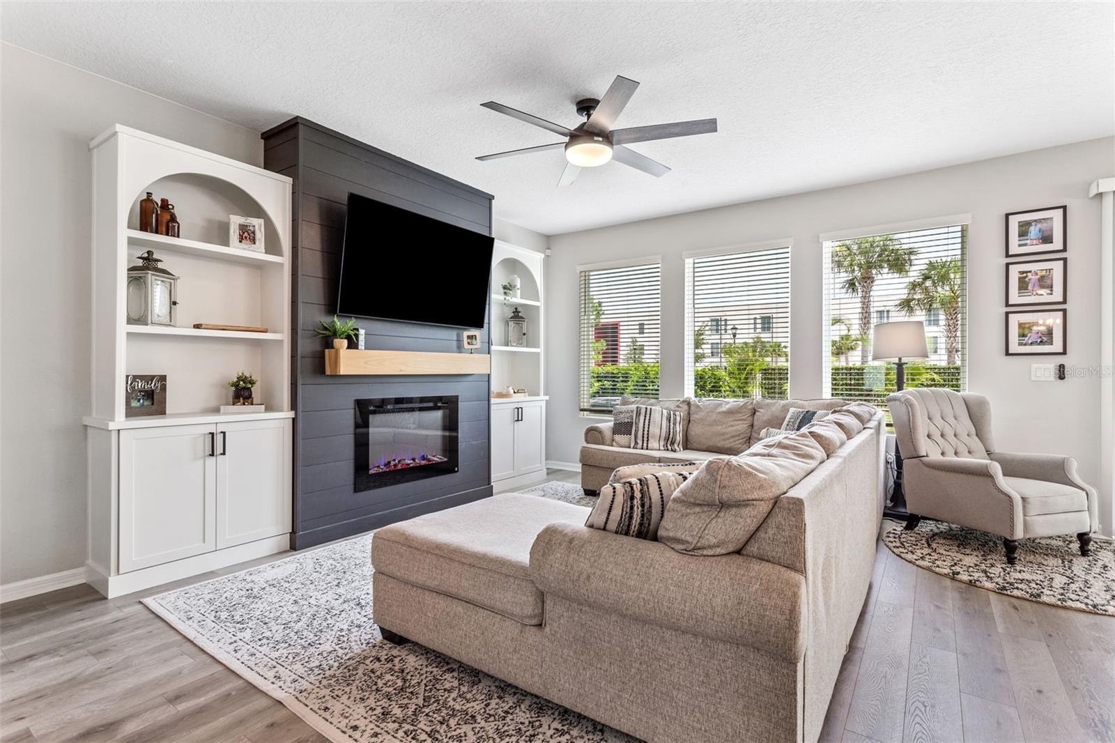 Living room with custom built in shelving/accents