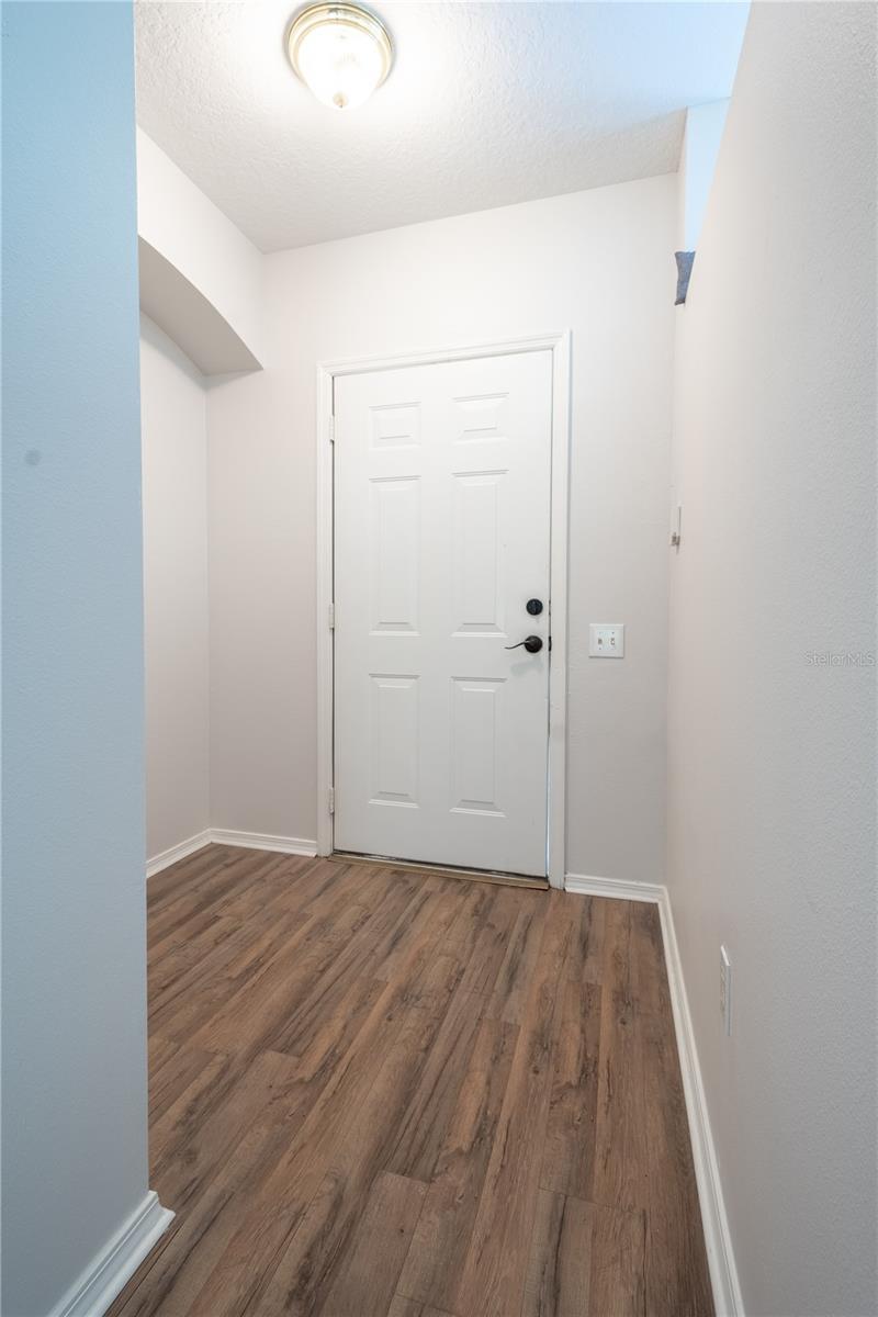 The Entrance features wood laminate flooring