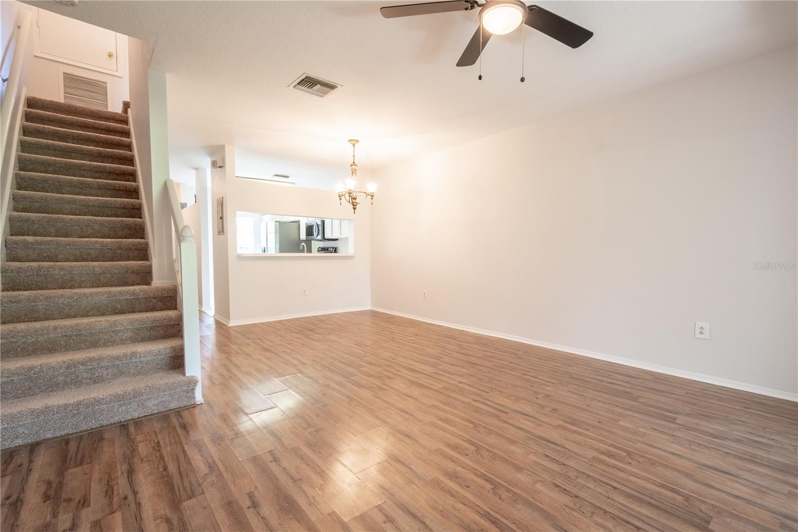 Carpeted stairway leads to the 2nd floor.