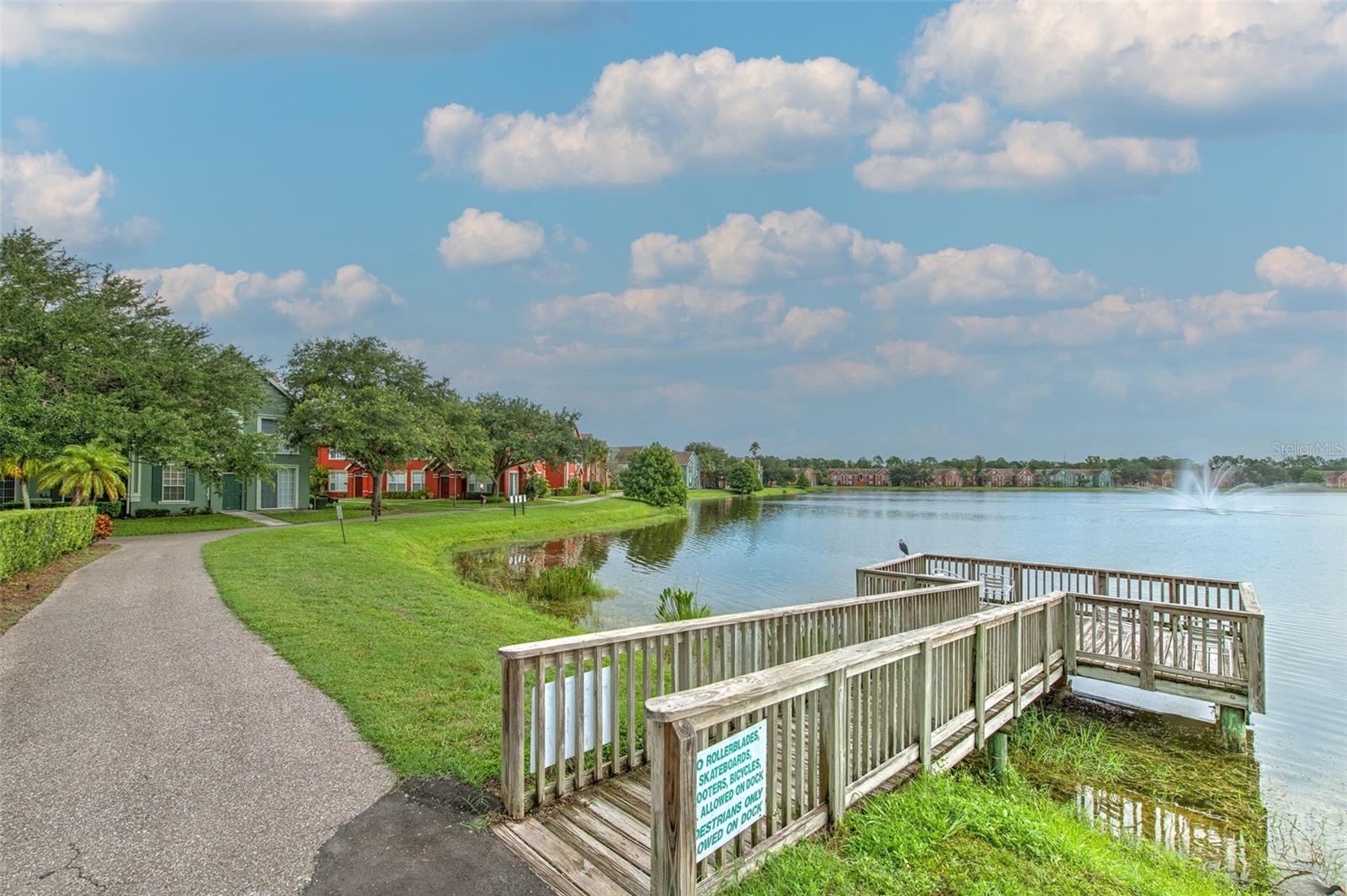 large lake with dock and water fountain