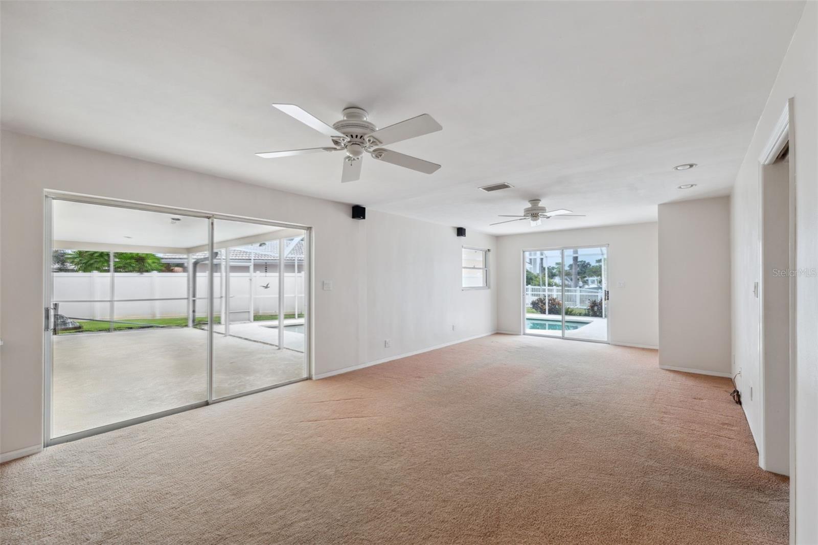 Family room w/2 sets of sliders to pool deck