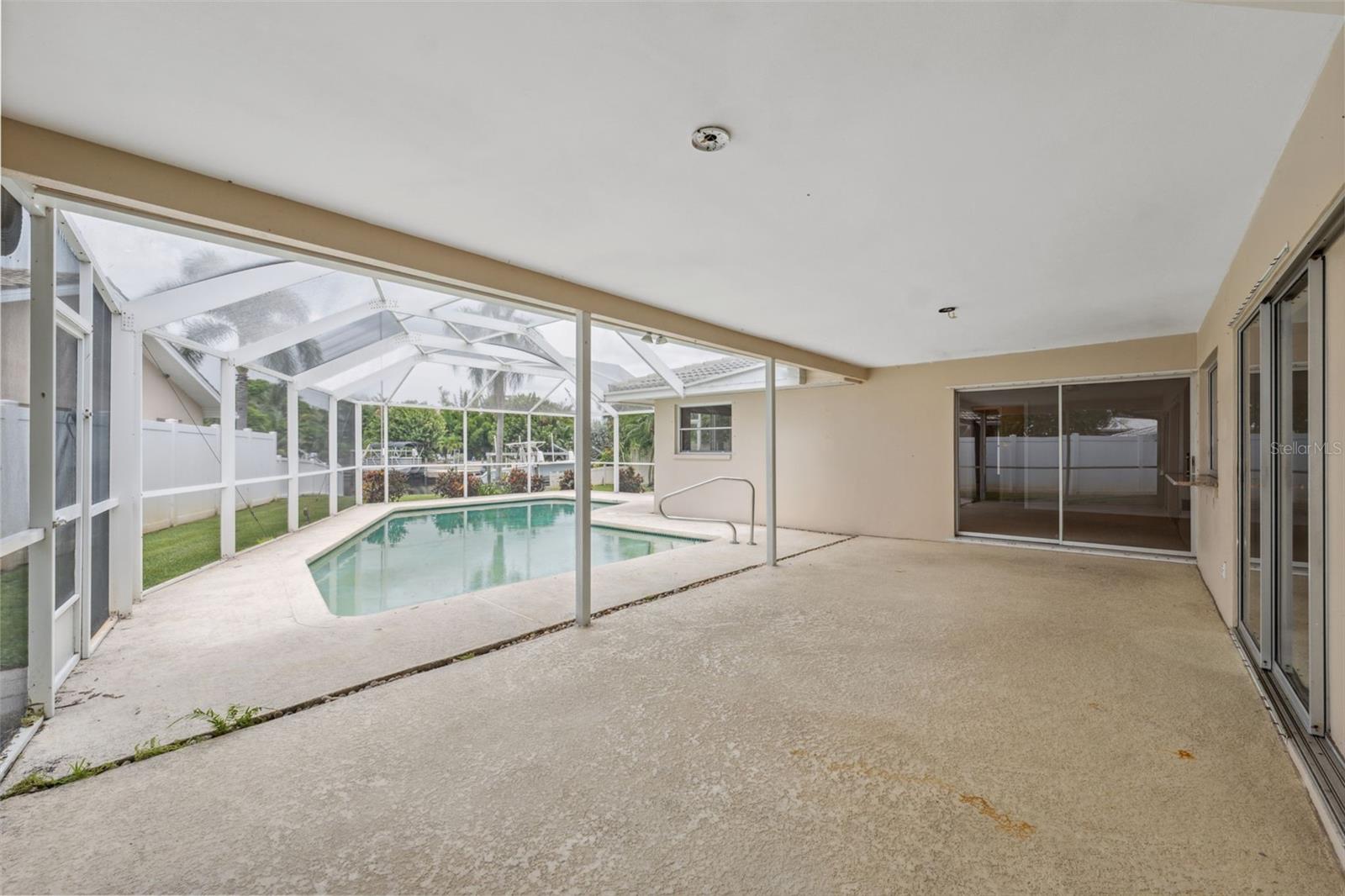 Rear Patio with 2 sets of sliders and sliding pass through window from kitchen