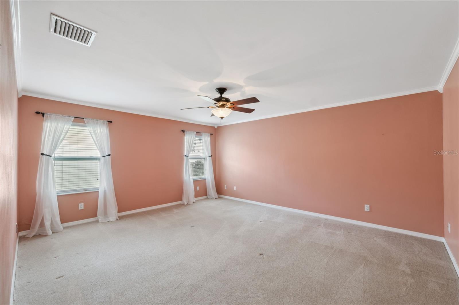 Large ensuite bedroom with dressing area